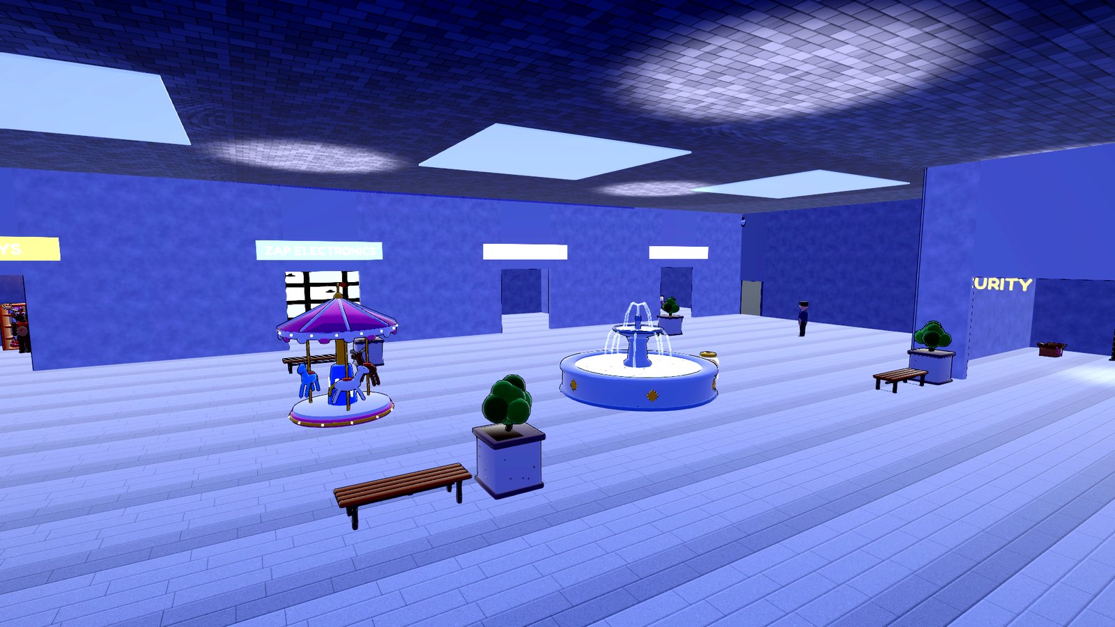 A shopping mall atrium at night with a carousel and fountain